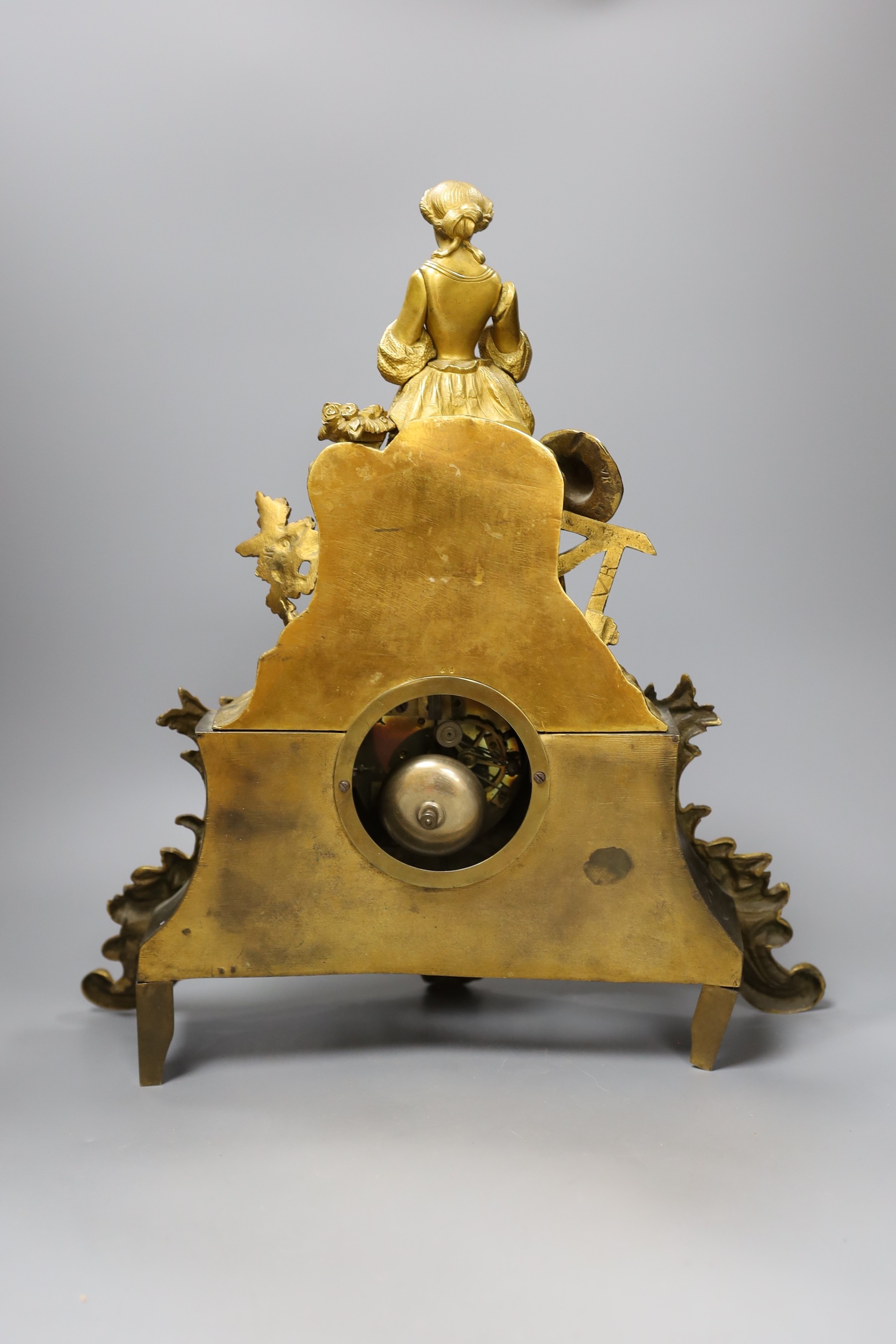 A 19th century French rococo style mantel clock, with pendulum, 42cm